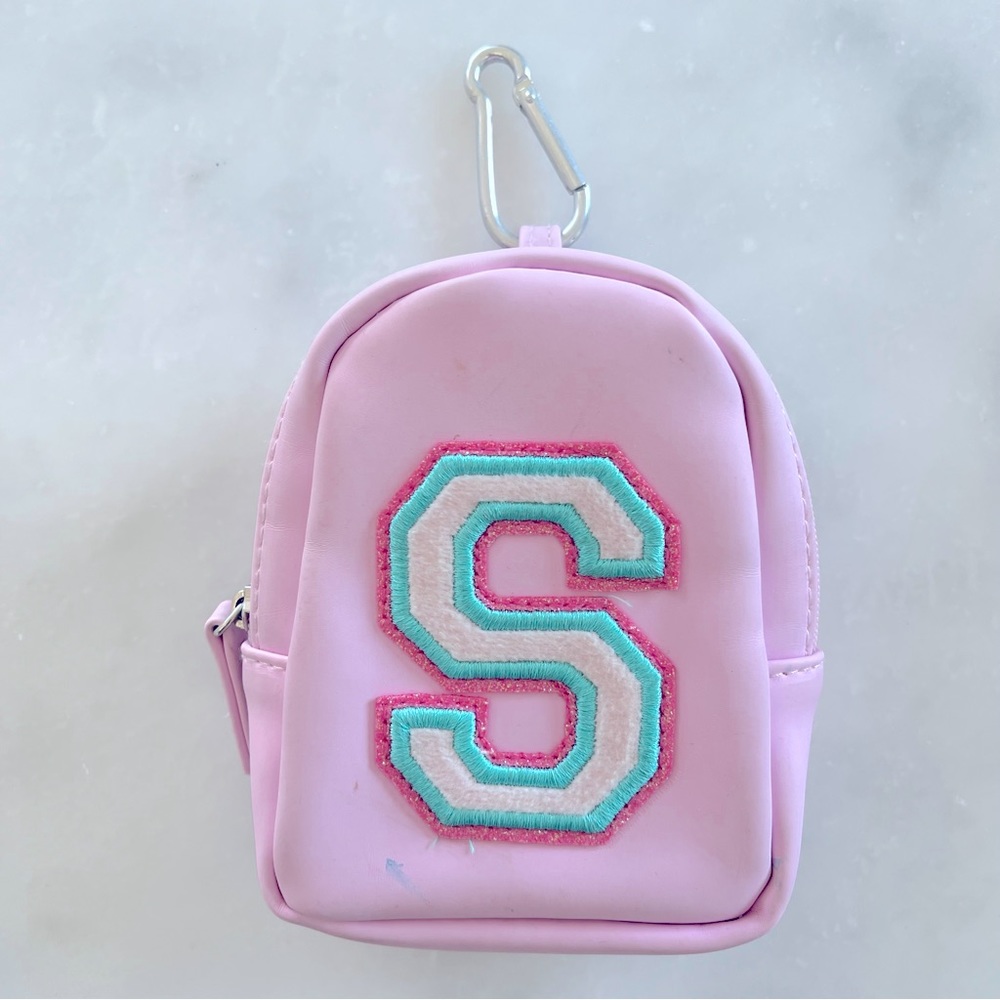 Claire’s Letter S initial Monogram mini keychain backpack. Pink